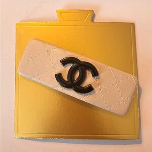 Faux leather cream hair clip with monogram cream and black